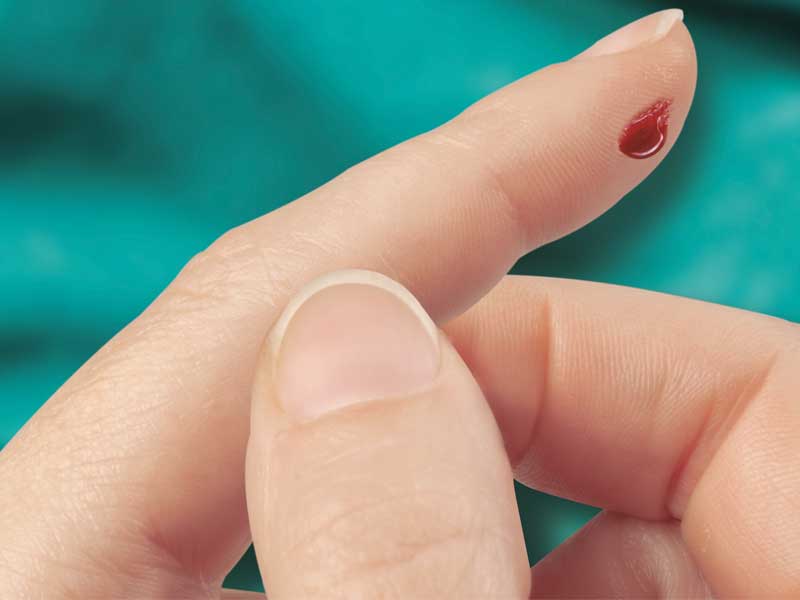 Fingerspitze mit Blut